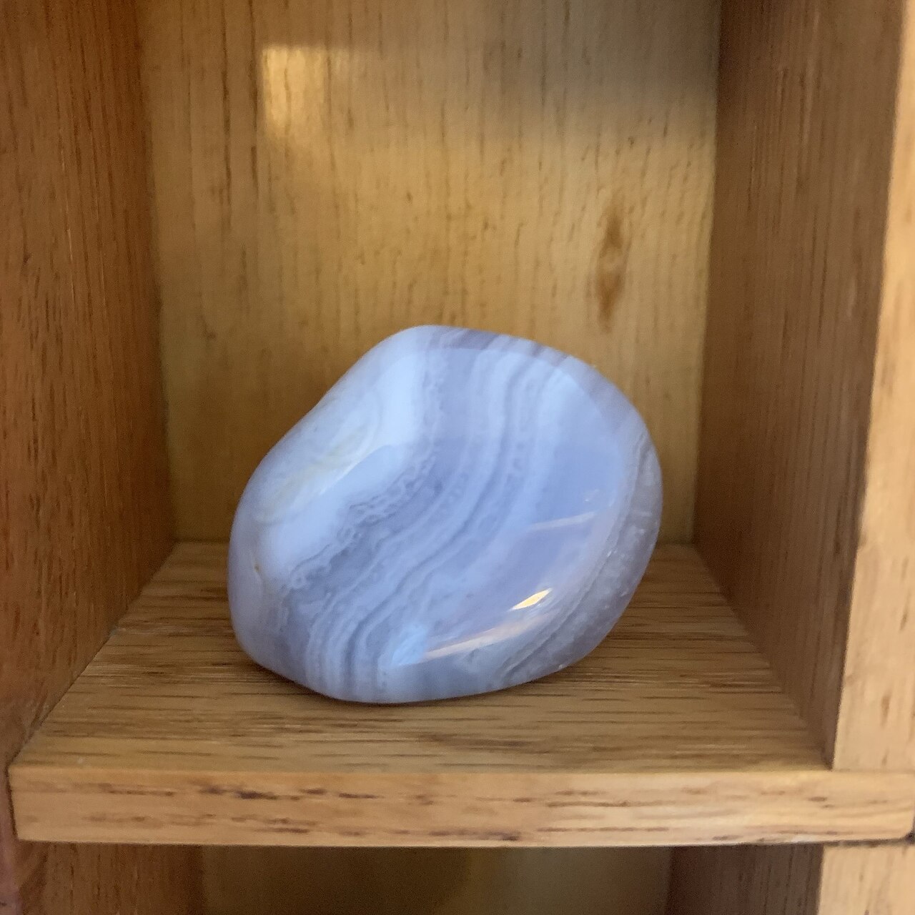 Polished blue lace agate with soft blue and white banding