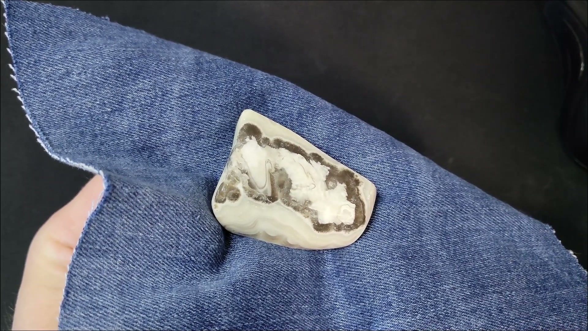 Finished polished agate with smooth surface and visible banding