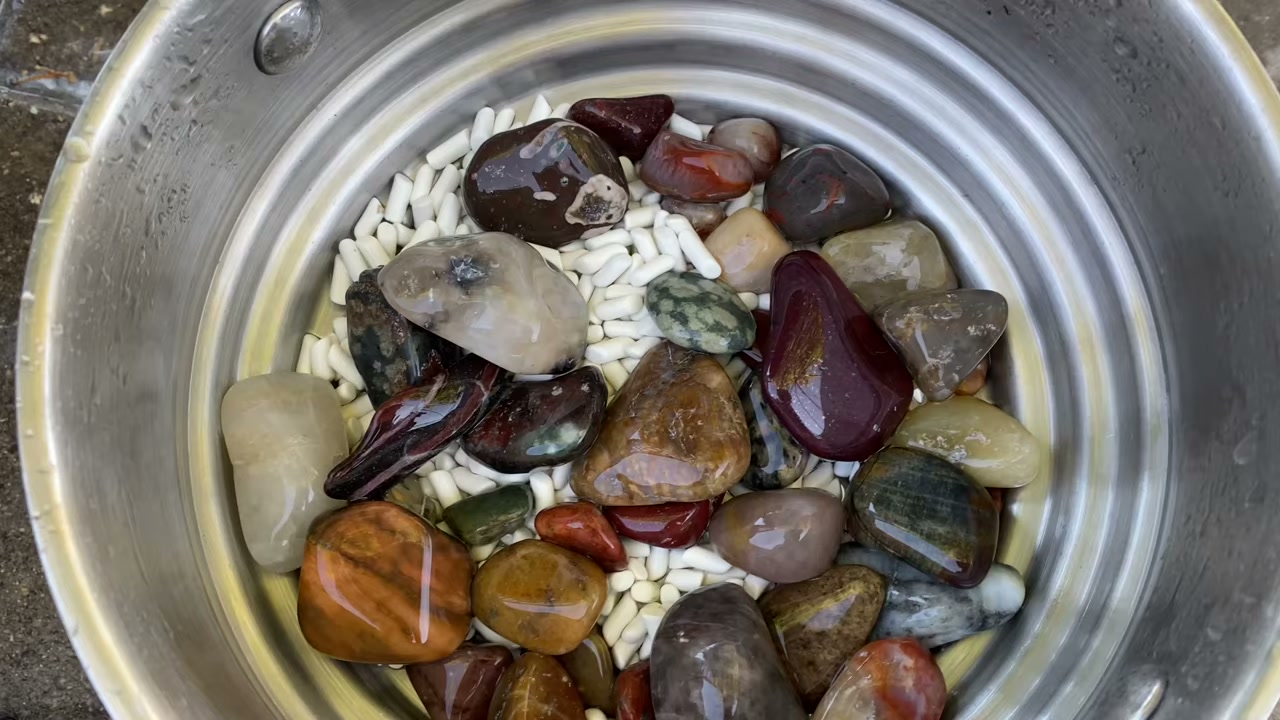 Adding silicon carbide grit to a rock tumbler barrel during the coarse grind stage