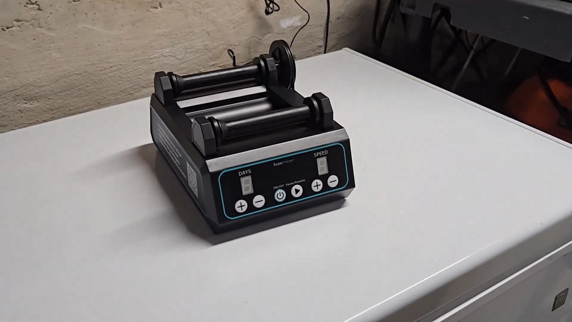 KomeStone K1 Pro brushless rock tumbler on desk showing control panel