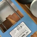 Lortone 3A rock tumbler close-up showing the model label and blue metal housing