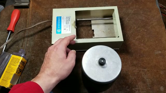 Complete Lortone 3A rock tumbler setup with barrel and base on workbench